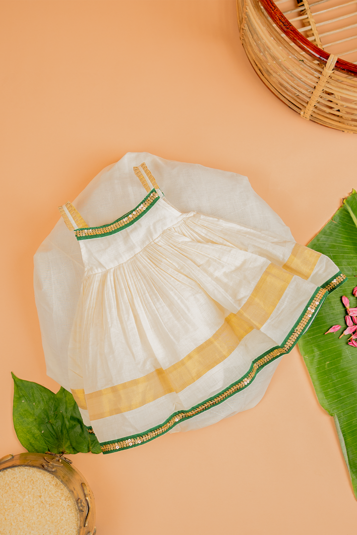 GIRLS FESTIVE KERALA KASAVU FROCK WITH GREEN LACE DETAILING GIRLS FESTIVE KERALA KASAVU FROCK WITH GREEN LACE DETAILING