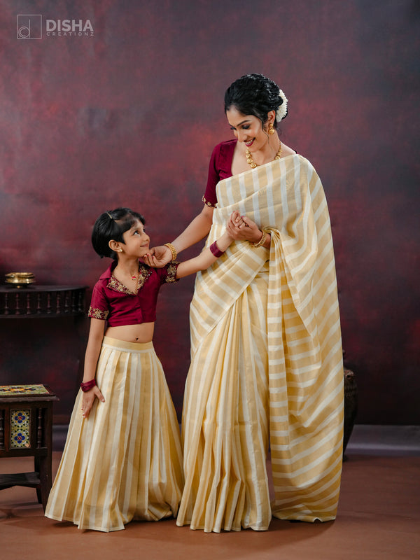 Pavitra & Tara - Stylish Onam Mother-Daughter Combo – Cream & Gold Saree with Coffee Brown Accents