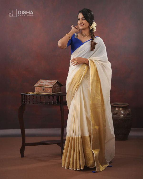 Neelam - Kerala Kasavu Cotton Saree with Royal Blue Border & Tassels – Paired with Dupion Silk Handwork Blouse for Festive Wear