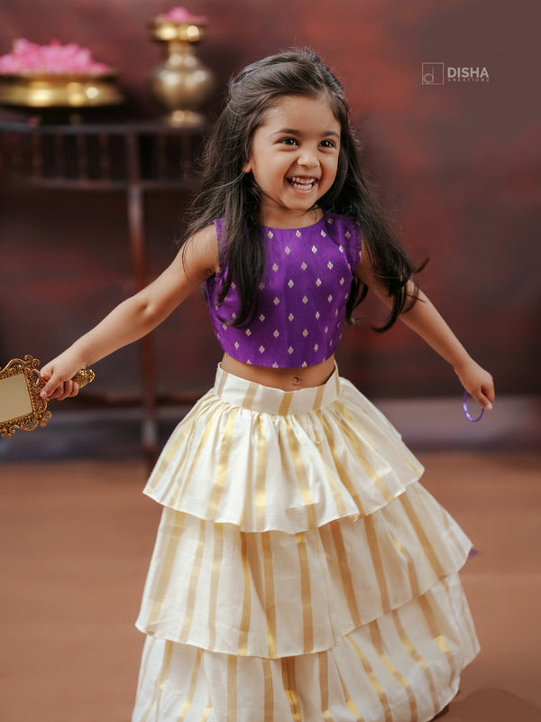 Thennal   Girls’ Cream three layer Cotton Skirt with Golden Stripes & Violet Chanderi Buttas Top
